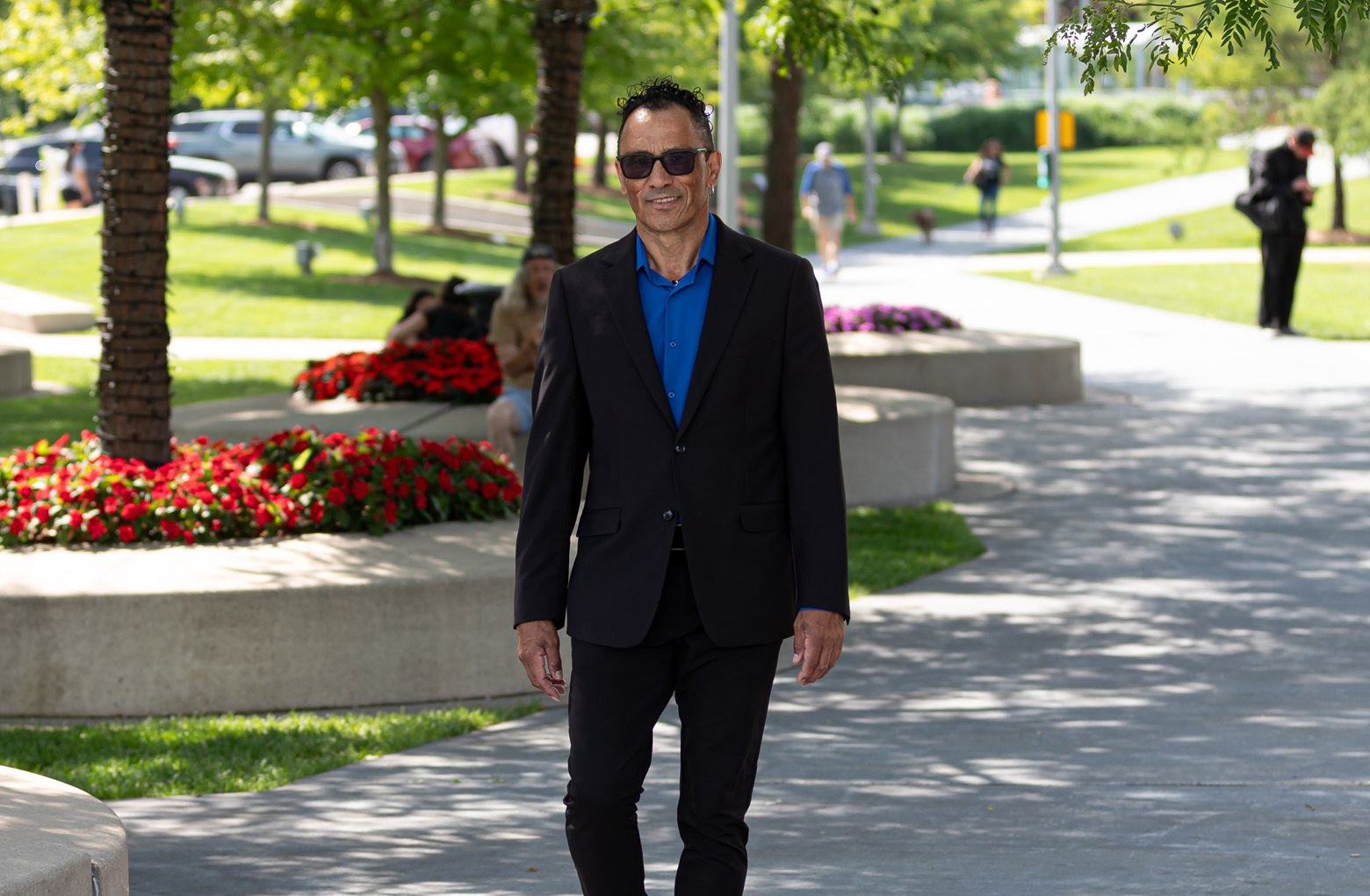 Glenn Marais walking through a landscaped Newmarket public space